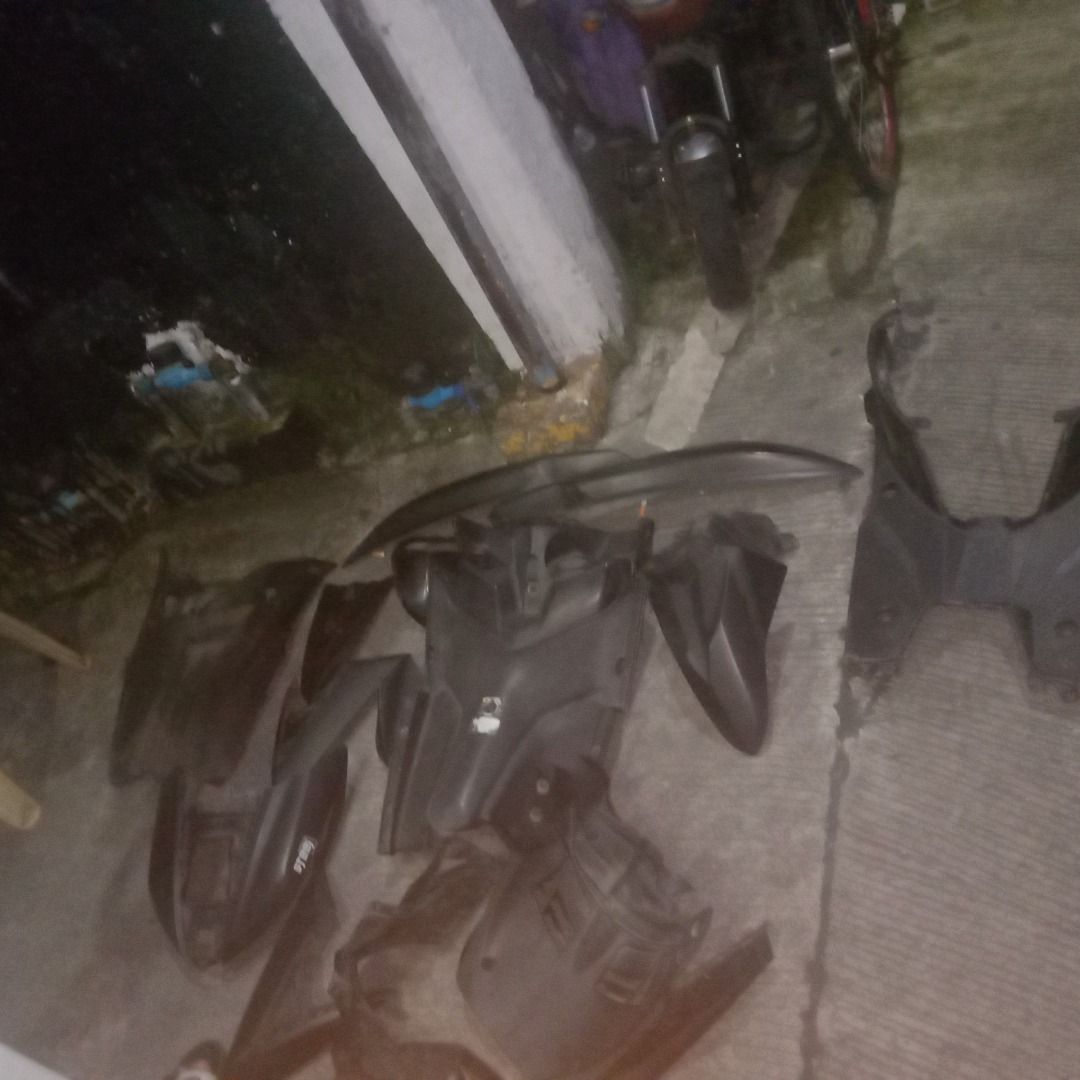 Black motorcycle body fairing set plastic covers (Category: Body Parts and Accessories) located in Manila. Submitted by louiebox05 (Listing ID 1468414923, Image 2). Description: - Complete black plastic motorcycle fairing set (full body panels and covers) - Normal wear from previous mounting and use - No cracks visible on the main pieces - Ideal spares for replacements or restoration projects - Garage clear-out item, priced to sell.