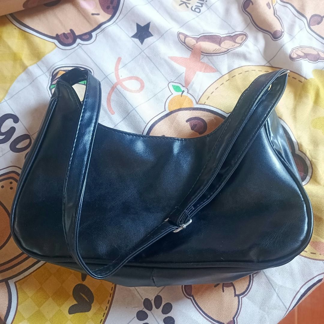 Black PU Leather Small Ita Bag (Category: Shoulder Bags) located in Pateros City. Submitted by taeja-vu (Listing ID 1468332289, Image 3). Description: Material: PU Leather Honest Flaws: Fraying ends on the inner fabric. Factory issue, temporarily resolved with safety pins. Overall condition: 8/10, no scratches or flaws in the zipper or adjustable strap. MOP: Gcash / Maribank (payo! buyer shoulders sf/hf) MOD: Lalamove, J&T, Meetup. .
