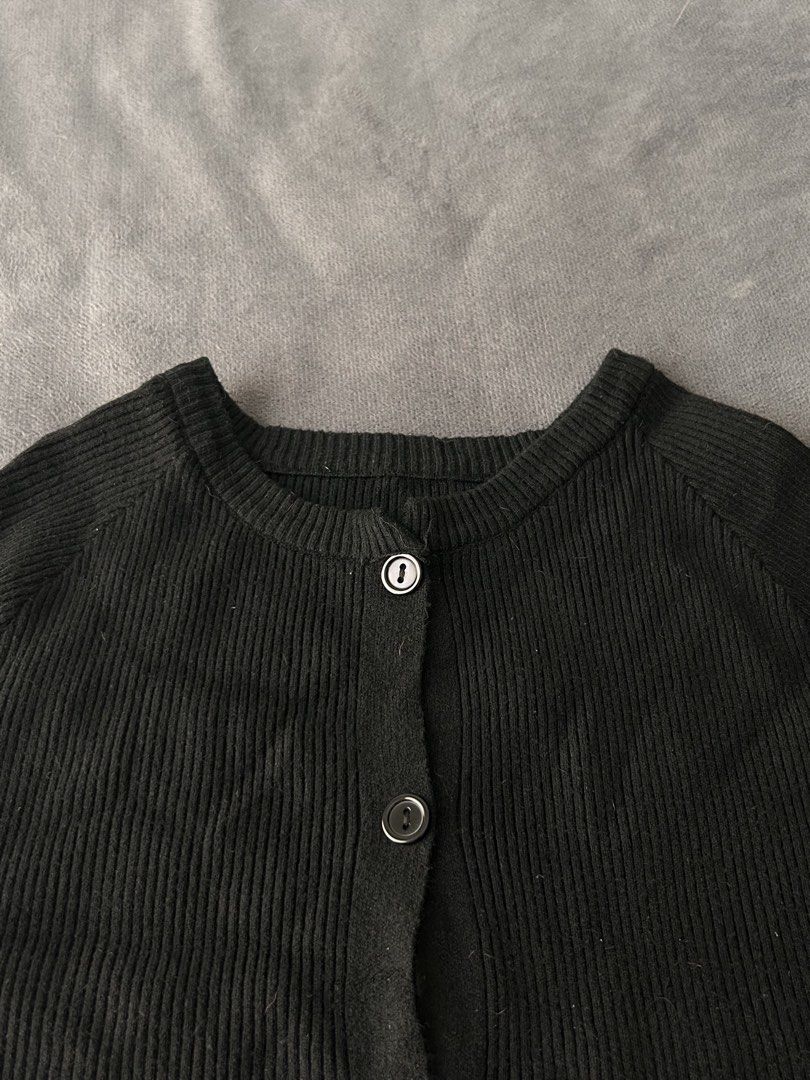 Black ribbed short sleeve button up crop top (Category: Blouses) located in Pasig City. Submitted by cha.declutterz (Listing ID 1468334972, Image 3). Description: - Color: Black - Free size (S-M) - Style: Short-sleeve ribbed cardigan top with front buttons - Fit: Cropped length, round neckline - Material: Soft and stretchy knit - Pairing: Great for matching with high-waisted pants or skirts.