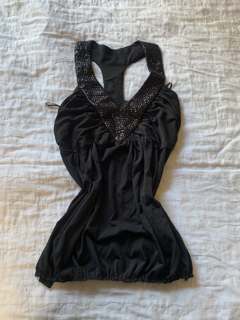 Black Sequin Halter Tank Top (Category: Sleeveless) located in Sarangani. Submitted by solune_clo (Listing ID 1468405905, Image 1). Description: - Color: Black - Details: Sparkly sequin trim on neckline and racerback straps - Fit: Gathered fabric across the front and bottom hem with stretchy material - Style: Versatile, easy to dress up or down - Condition: Pre-loved, closet cleanout.