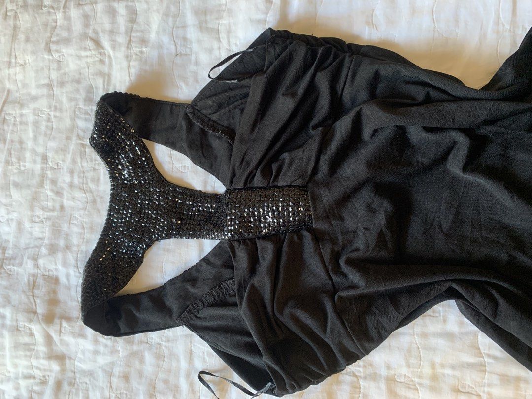 Black Sequin Halter Tank Top (Category: Sleeveless) located in Sarangani. Submitted by solune_clo (Listing ID 1468405905, Image 2). Description: - Color: Black - Details: Sparkly sequin trim on neckline and racerback straps - Fit: Gathered fabric across the front and bottom hem with stretchy material - Style: Versatile, easy to dress up or down - Condition: Pre-loved, closet cleanout.