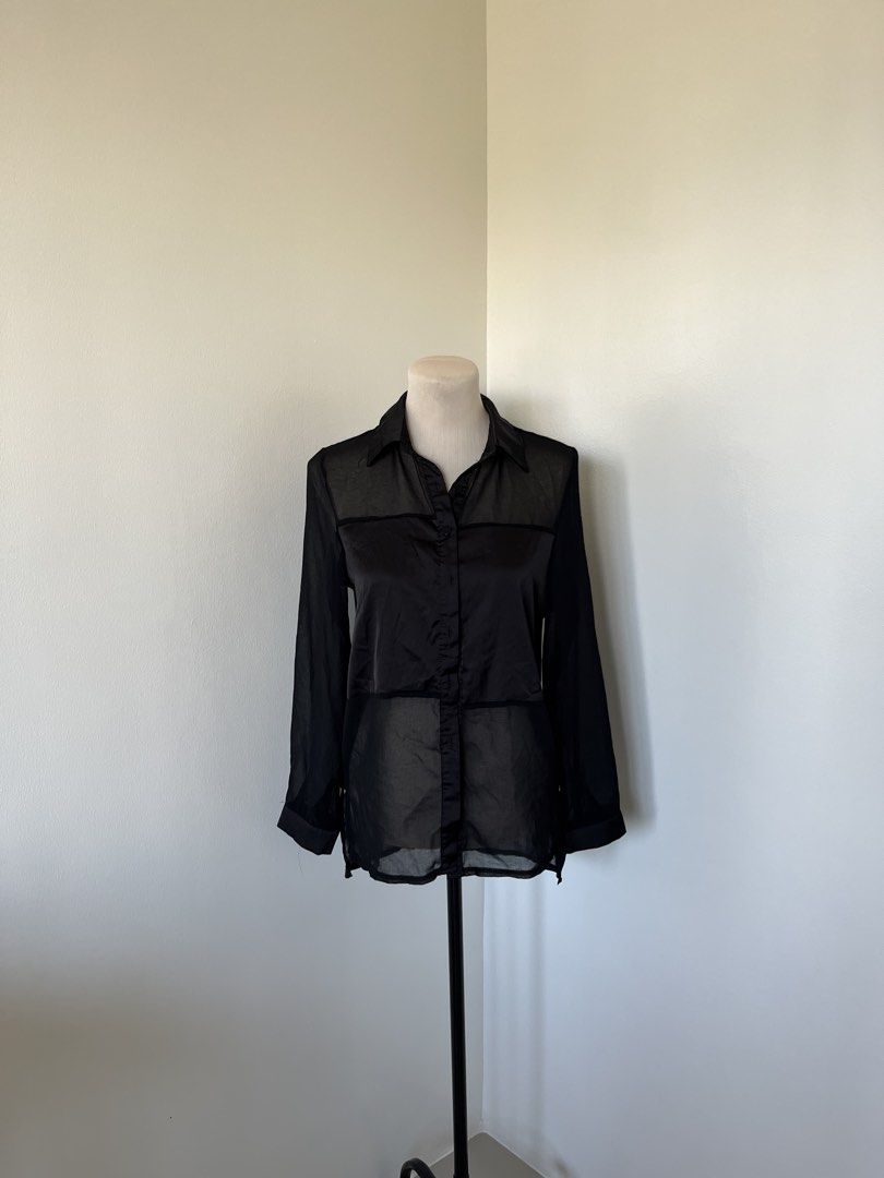Black Sheer Button-Down Blouse Long Sleeve (Category: Longsleeves) located in Mandaluyong City. Submitted by bravedeer.020ad7 (Listing ID 1468364419, Image 1). Description: - Color & Style: Black sheer button-down shirt with long sleeves and classic collar - Design Details: Horizontal panel accents on front and back yoke - Fit & Sizing: Standard fit, measures roughly 13" across shoulders and 28" in total length - Material: Lightweight fabric feat