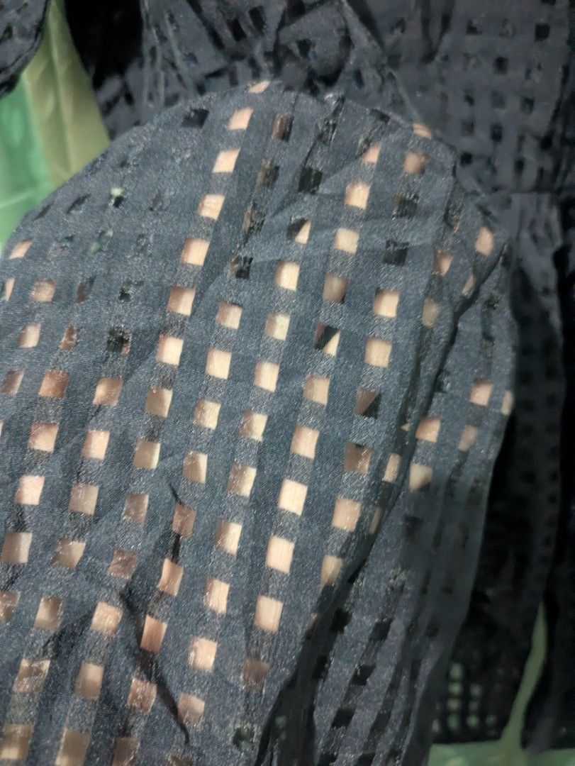 Black Sheer Checkered Puff Sleeve Blouse Size M (Category: Blouses) located in Bocaue. Submitted by _agentorange (Listing ID 1468364968, Image 3). Description: - Color & Pattern: Navy Blue with a checkered grid mesh pattern - Fit & Style: Puff sleeves and a gently flared peplum waist - Details: Back button closure at the neckline - Material: Lightweight, slightly sheer polyester - Size: Medium (M tag attached) - Thrifted by seller, tight on 35 bu