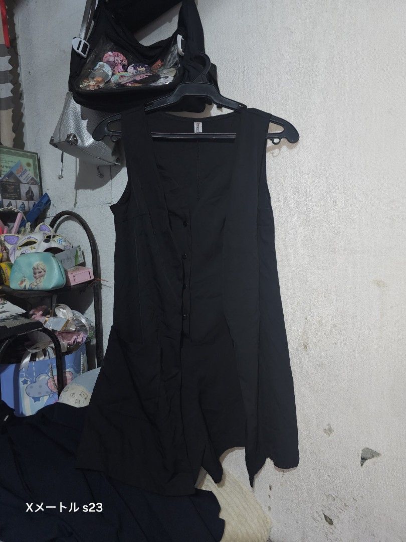 Black sleeveless button-down midi dress (Category: Dresses) located in Manila. Submitted by billydelar93312 (Listing ID 1468360571, Image 1). Description: - Color: Solid black - Design: Button-down front with small dark buttons - Cut: Sleeveless, fitted bodice with a flared skirt - Material: Smooth, comfortable fabric - Style: Versatile basic piece, easy to dress up or down for any occasion.