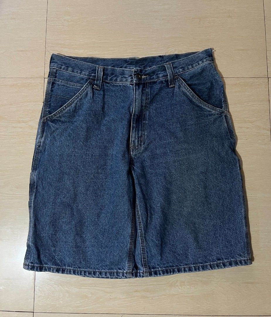 Blue Denim Cargo Shorts Carpenter Style (Category: Shorts) located in Manila. Submitted by kaloyyyyyy (Listing ID 1468347050, Image 2). Description: - Color: Washed dark blue - Material: Sturdy denim fabric - Storage: Utility pockets on both sides and deep back pockets with double stitching - Fit/Details: Multiple belt loops around the waistband - Style: Great casual everyday shorts.