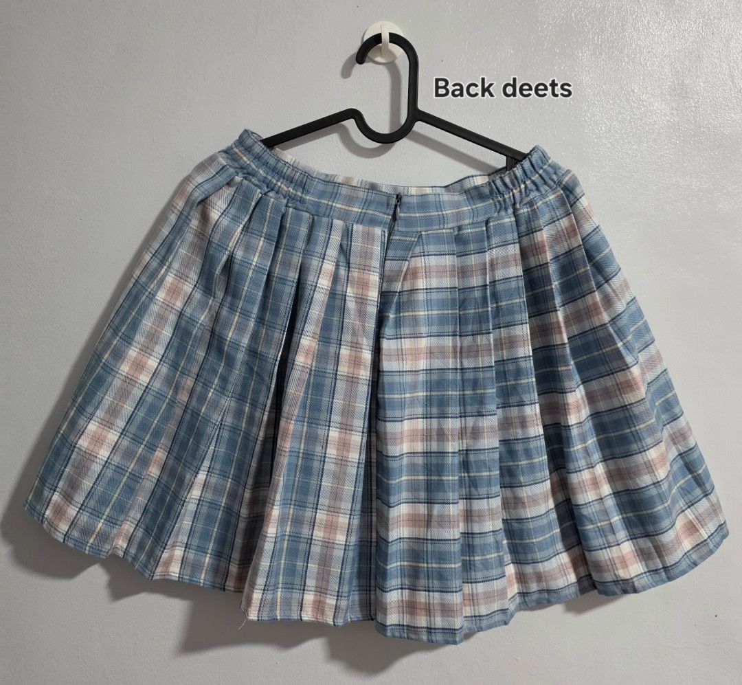 Blue Plaid Pleated Skirt (Category: Skirts) located in Paranaque City. Submitted by franinnashop (Listing ID 1468361681, Image 3). Description: Declutter - Style: Blue, pink, and white plaid pleated skirt - Fit: High waist with partial elastic band at the back for comfort - Closure: Hidden back zipper - Size: XL (Tag) - Measurements: Waist 28-30 inches, Length 17 inches - Condition: Clean fabric, pleats hold shape well.