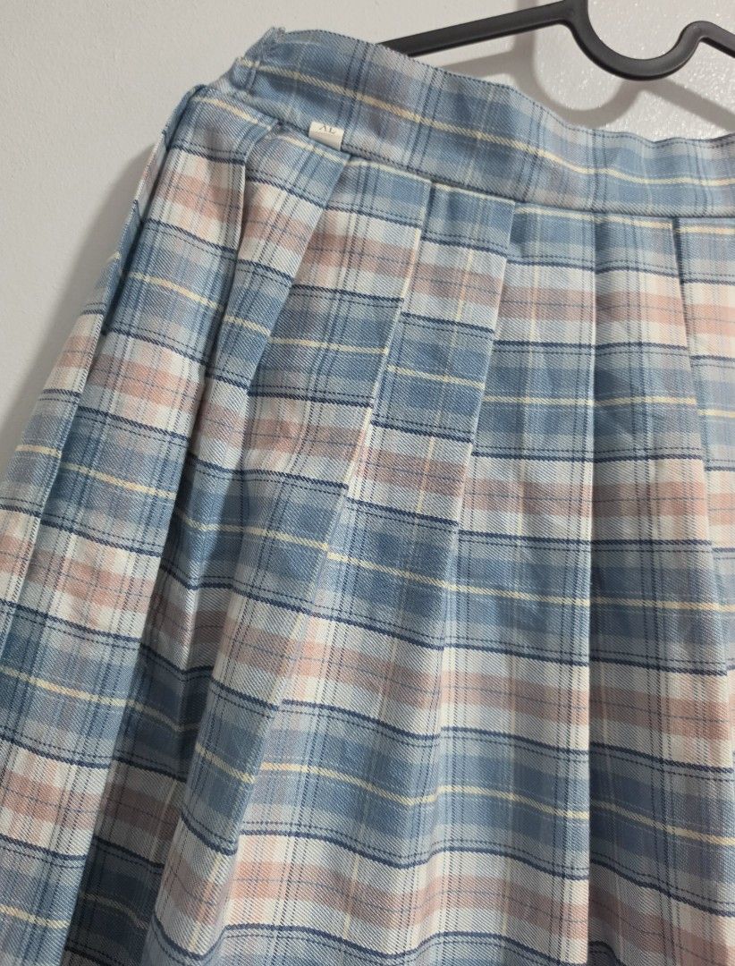 Blue Plaid Pleated Skirt (Category: Skirts) located in Paranaque City. Submitted by franinnashop (Listing ID 1468361681, Image 2). Description: Declutter - Style: Blue, pink, and white plaid pleated skirt - Fit: High waist with partial elastic band at the back for comfort - Closure: Hidden back zipper - Size: XL (Tag) - Measurements: Waist 28-30 inches, Length 17 inches - Condition: Clean fabric, pleats hold shape well.