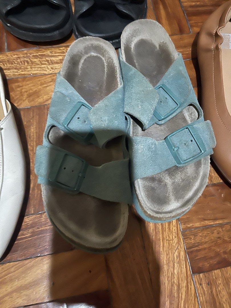 Blue Suede Double Buckle Slide Sandals (Category: Flats & Sandals) located in Manila. Submitted by evelyngrac95466 (Listing ID 1468323259, Image 1). Description: - Color & Material: Blue suede slip-on sandals - Design: Two adjustable straps with matching blue buckles - Footbed: Comfortable cork footbed (note: shows visible wear from previous use) - Fit: Fits standard sizes - Style: Classic everyday casual wear.