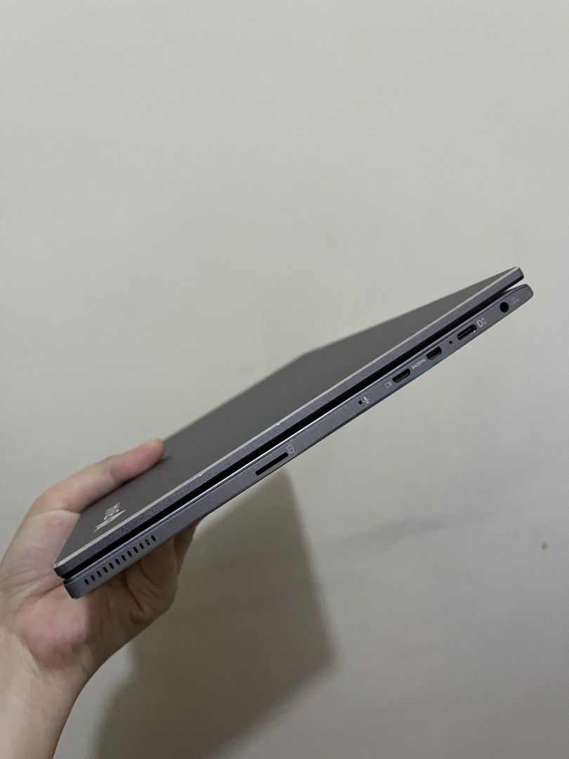 BMAX Convertible Laptop (Category: Laptops & Notebooks) located in Trece Martires City. Submitted by cas_05 (Listing ID 1468407484, Image 3). Description: - Model: BMAX 2-in-1 Touchscreen Laptop (8gb/128gb SSD) - Color: Grey - Design: 360-degree hinges for tablet and laptop modes - Input: Standard QWERTY keyboard and responsive trackpad - Ports: USB-C, mini HDMI, headphone jack, and micro SD card slot - Controls: Side-mounted power button and vol