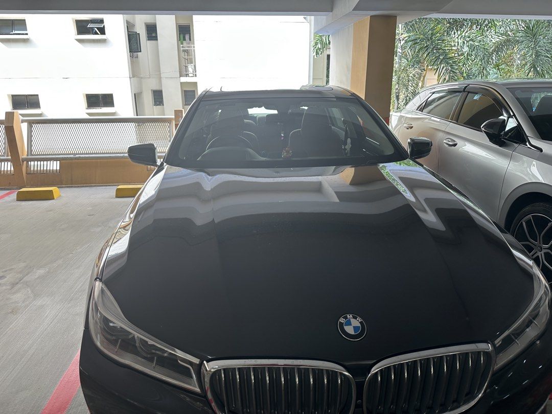 BMW 7 Series 730Li Design Pure Excellence (A) (Category: Used Cars) located in Singapore. Submitted by daringraj (Listing ID 1468403353, Image 3). Description: Dark grey BMW 730 luxury sedan. Spacious cabin featuring premium tan leather seats, rear air conditioning vents, and digital display screen. Distinctive alloy rims fitted with Bridgestone tyres. Classic kidney front grille and sleek silhouette. Well-maintained bodywork and clean interior s