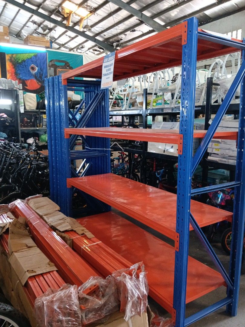 Bodega Rack Heavy Duty 4 Layer Storage Shelving Unit (Category: Shelves, Cabinets & Racks) located in Manila. Submitted by jesicahmrsantarosa (Listing ID 1468297105, Image 3). Description: - Condition: Brand new, unused, and still in original packaging with plastic wrapping - Dimensions: 200cm (L) x 60cm (W) x 200cm (H) - Design: 4 heavy-duty layers with bright orange shelves and blue upright posts - Bonus: Extra beams included in the stack - Ide
