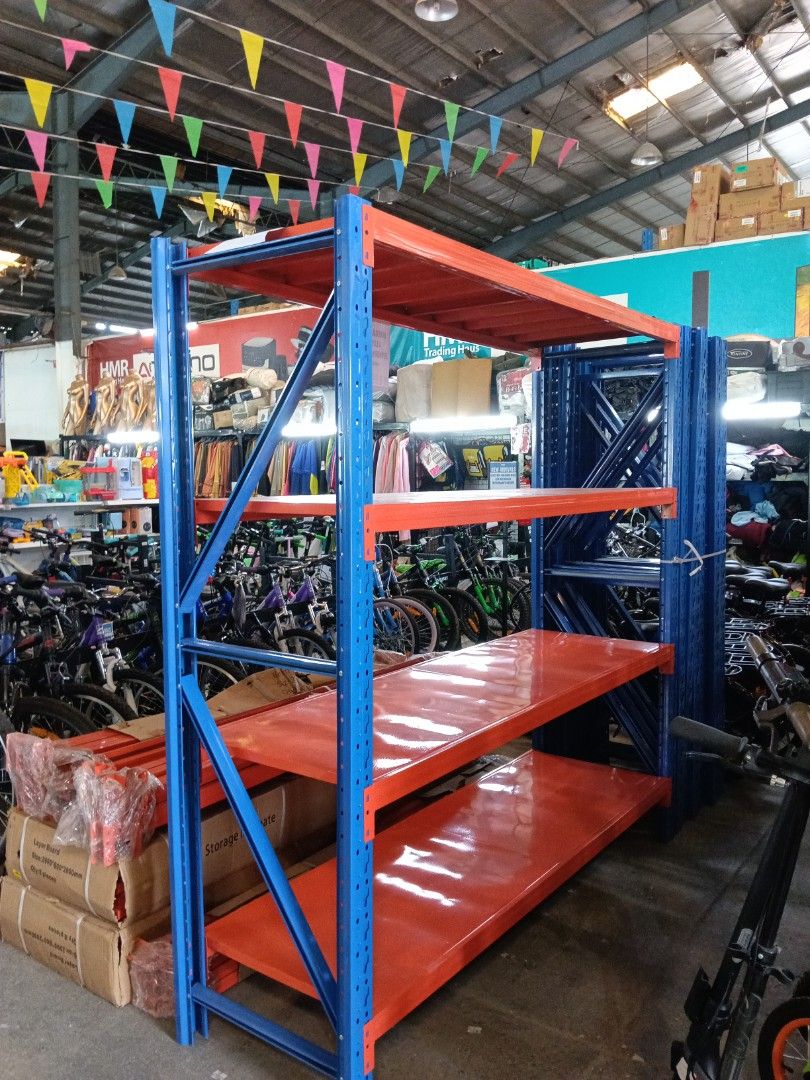 Bodega Rack Heavy Duty 4 Layer Storage Shelving Unit (Category: Shelves, Cabinets & Racks) located in Manila. Submitted by jesicahmrsantarosa (Listing ID 1468297105, Image 1). Description: - Condition: Brand new, unused, and still in original packaging with plastic wrapping - Dimensions: 200cm (L) x 60cm (W) x 200cm (H) - Design: 4 heavy-duty layers with bright orange shelves and blue upright posts - Bonus: Extra beams included in the stack - Ide