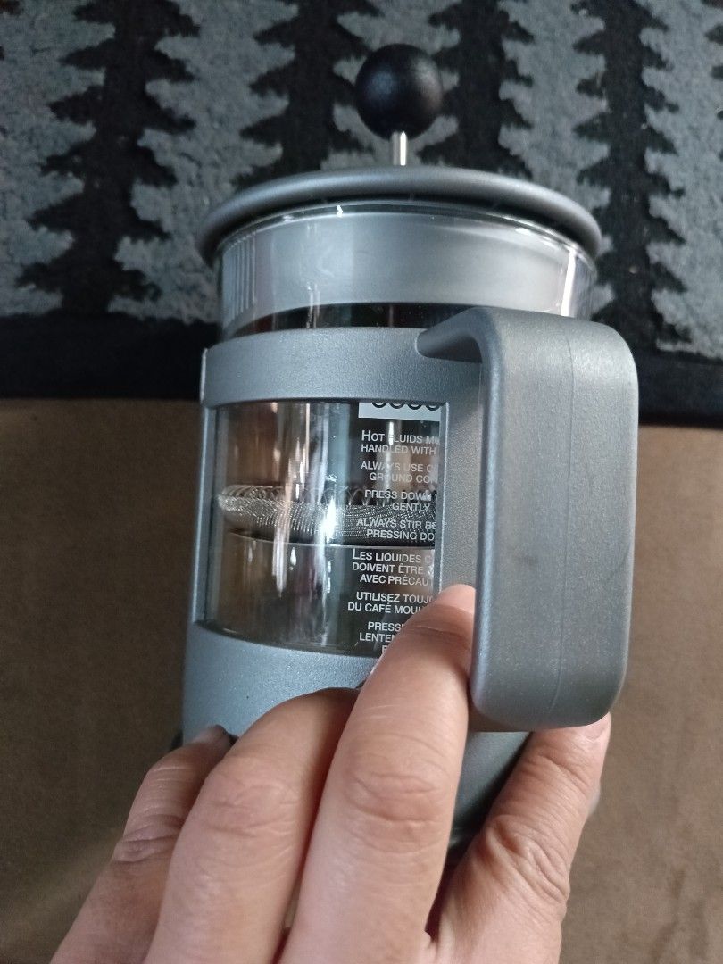 bodum french press or coffee press (Category: Coffee & Tea Tableware) located in Tanauan. Submitted by tyrone4 (Listing ID 1468334614, Image 2). Description: Bodum brand name, a stainless steel rod, and a mesh filter mechanism designed to press down coffee grounds or loose tea leaves.