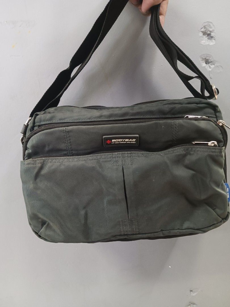 Bodysac Sling Bag (Category: Sling Bags) located in Quezon City. Submitted by arvietekto (Listing ID 1468364659, Image 1). Description: - Brand/Style: Authentic Bodysac classic utility shoulder bag - Color: black adjustable strap - Hardware: Branded metal buckle on the strap and model patch (CW20013383A MFD 9920) - Material: Tough, durable fabric built for everyday wear - Organization: Multiple zippered compartments and plenty of pockets for your