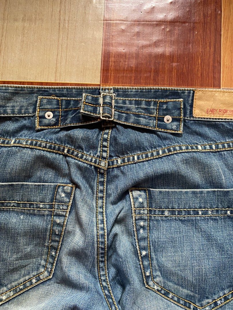 Bootcut Jeans (Category: Jeans) located in General Santos City (Dadiangas). Submitted by versatile__ (Listing ID 1468329532, Image 3). Description: Easy Rider - Buckled Bootcut Loose Jeans waist : 34 inches length : 43 inches thigh : 13 inches hem : 10.5 inches good condition- nine out ten color rate featuring buckle on the back area -heelbites due to heeldrag and minor hole near in hem -need wash! +Shipping Fee.