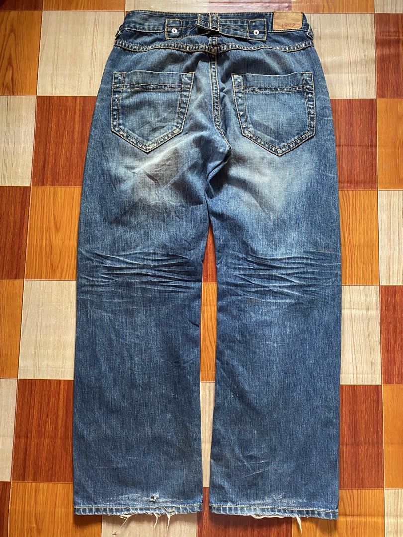 Bootcut Jeans (Category: Jeans) located in General Santos City (Dadiangas). Submitted by versatile__ (Listing ID 1468329532, Image 2). Description: Easy Rider - Buckled Bootcut Loose Jeans waist : 34 inches length : 43 inches thigh : 13 inches hem : 10.5 inches good condition- nine out ten color rate featuring buckle on the back area -heelbites due to heeldrag and minor hole near in hem -need wash! +Shipping Fee.