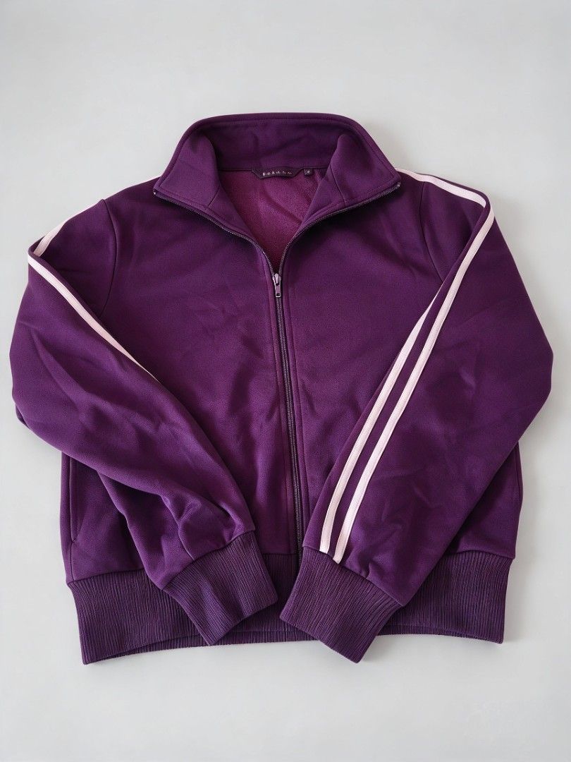 Bossini Purple Track Jacket with White Stripes (Category: Coats, Jackets and Outerwear) located in Batangas. Submitted by mace2014 (Listing ID 1468307356, Image 2). Description: - Brand: Bossini - Color: Deep plum purple with dual white stripes on sleeves - Design: Zip-up front with a high collar - Lining: Soft fleece interior for extra warmth - Fit: Ribbed cuffs and hem to maintain shape - Condition: Great pre-loved condition (ready to wear).