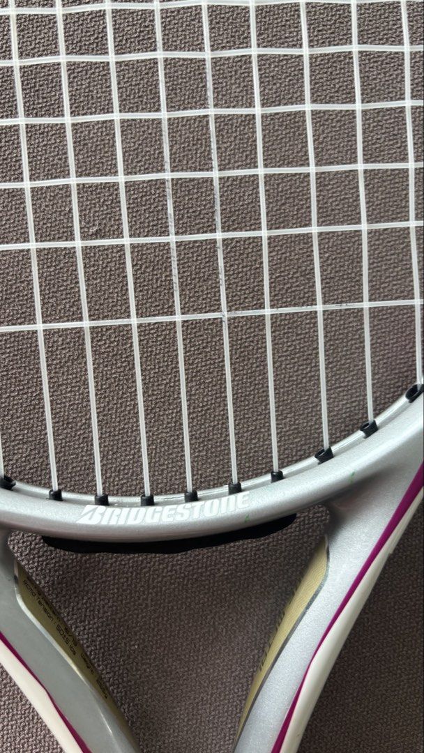 Bridgestone Dual Coil 2.65 Tennis Racket (Category: Racket and Ball Sports) located in Manila. Submitted by shopgirl17 (Listing ID 1468330558, Image 3). Description: Bridgestone Dual Coil 2.65 Tennis Racket - Like New - Face area - 110inch - Balance - 345mm - String pattern - 16/19 - Rcmd tension - 50 - Length - 27.25 inch - Weight - 265g.