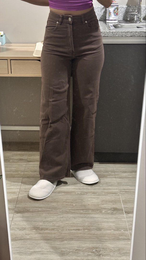 Brown High-Waisted Wide Leg Pants (Category: Jeans) located in Quezon City. Submitted by angelique.jsd (Listing ID 1468452048, Image 2). Description: - Color: Rich brown earthy tone - Fit: High-waisted with a trendy wide leg - Material: Soft and comfortable denim/twill fabric - Details: Front button closure, standard belt loops, classic five-pocket style - Styling: Pairs easily with basic tops for casual looks Payment Methods 💙 GCash 💚 Cash.