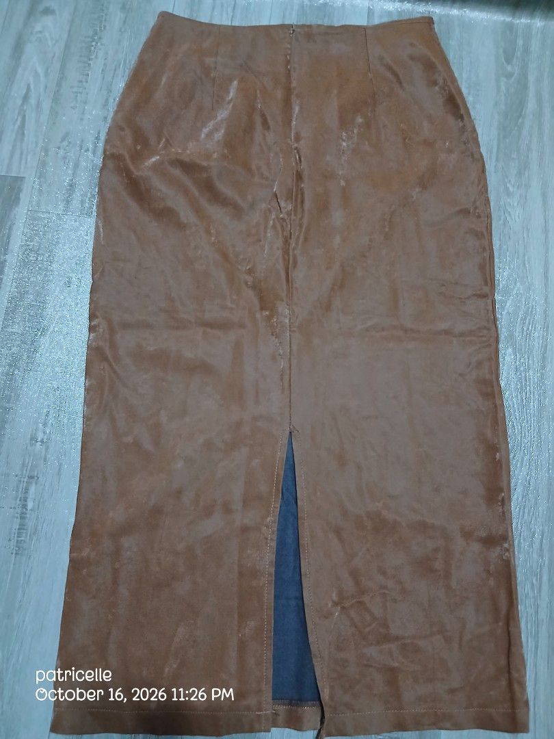 Brown Long Skirt with Back Slit – Unused (Category: Skirts) located in Manila. Submitted by patricielle (Listing ID 1468447575, Image 1). Description: Selling my brown long skirt. Never worn, only washed once at a laundry shop when it was still new. Natambak na lang and hindi na nagamit. Color: Brown Length: 33 inches Style: Long skirt with back slit Size: 31-32 Condition: Unused, with minor flaw Flaw: Small dark mark on the fabric after laundry.