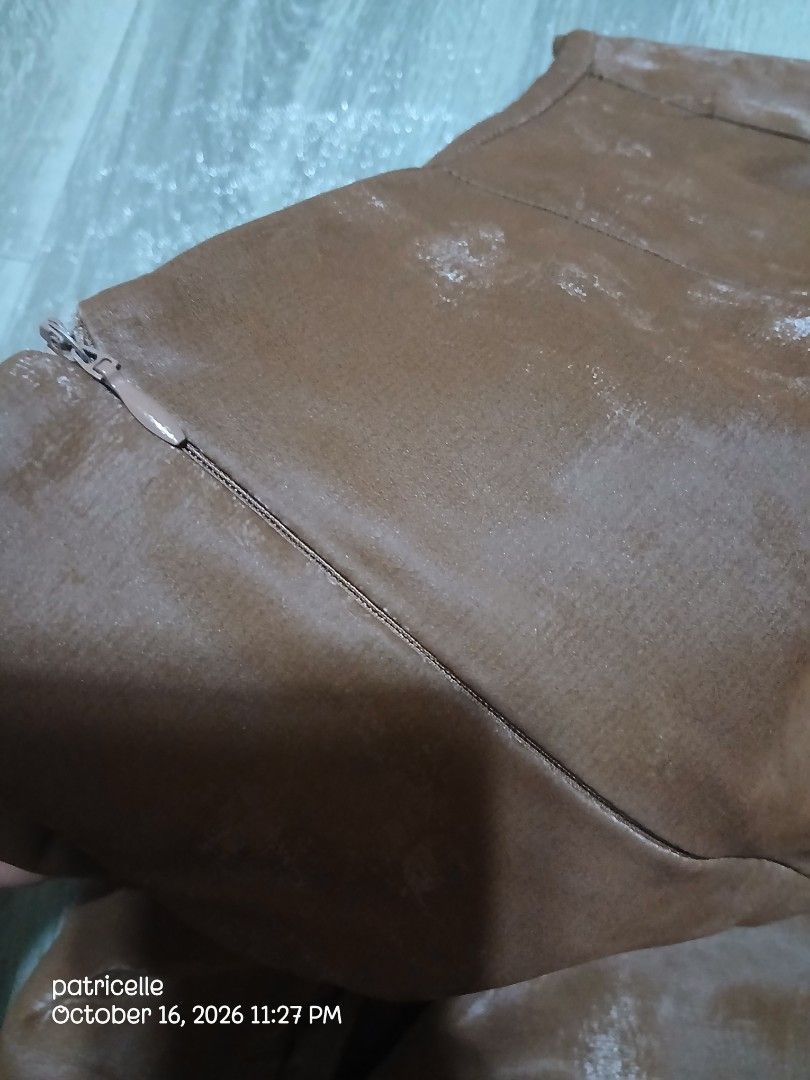 Brown Long Skirt with Back Slit – Unused (Category: Skirts) located in Manila. Submitted by patricielle (Listing ID 1468447575, Image 3). Description: Selling my brown long skirt. Never worn, only washed once at a laundry shop when it was still new. Natambak na lang and hindi na nagamit. Color: Brown Length: 33 inches Style: Long skirt with back slit Size: 31-32 Condition: Unused, with minor flaw Flaw: Small dark mark on the fabric after laundry.