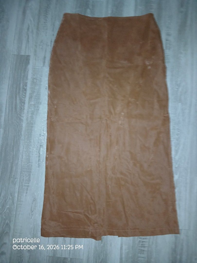 Brown Long Skirt with Back Slit – Unused (Category: Skirts) located in Manila. Submitted by patricielle (Listing ID 1468447575, Image 2). Description: Selling my brown long skirt. Never worn, only washed once at a laundry shop when it was still new. Natambak na lang and hindi na nagamit. Color: Brown Length: 33 inches Style: Long skirt with back slit Size: 31-32 Condition: Unused, with minor flaw Flaw: Small dark mark on the fabric after laundry.