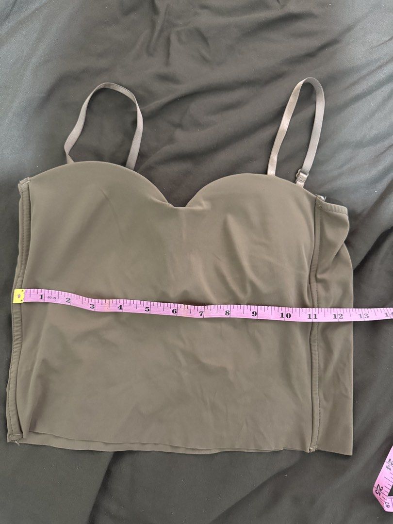 Brown Padded Camisole Top with Adjustable Straps (Category: Sleeveless) located in Quezon City. Submitted by turtleandfishes (Listing ID 1468316398, Image 2). Description: - Color: Brown - Style: Camisole top with built-in padded cups - Straps: Thin, adjustable shoulder straps with a straight back design - Material: Smooth, stretchy fabric for a comfortable fit - Measurements: 14" across the chest, 12" length from top of cup to hem - Condition: C