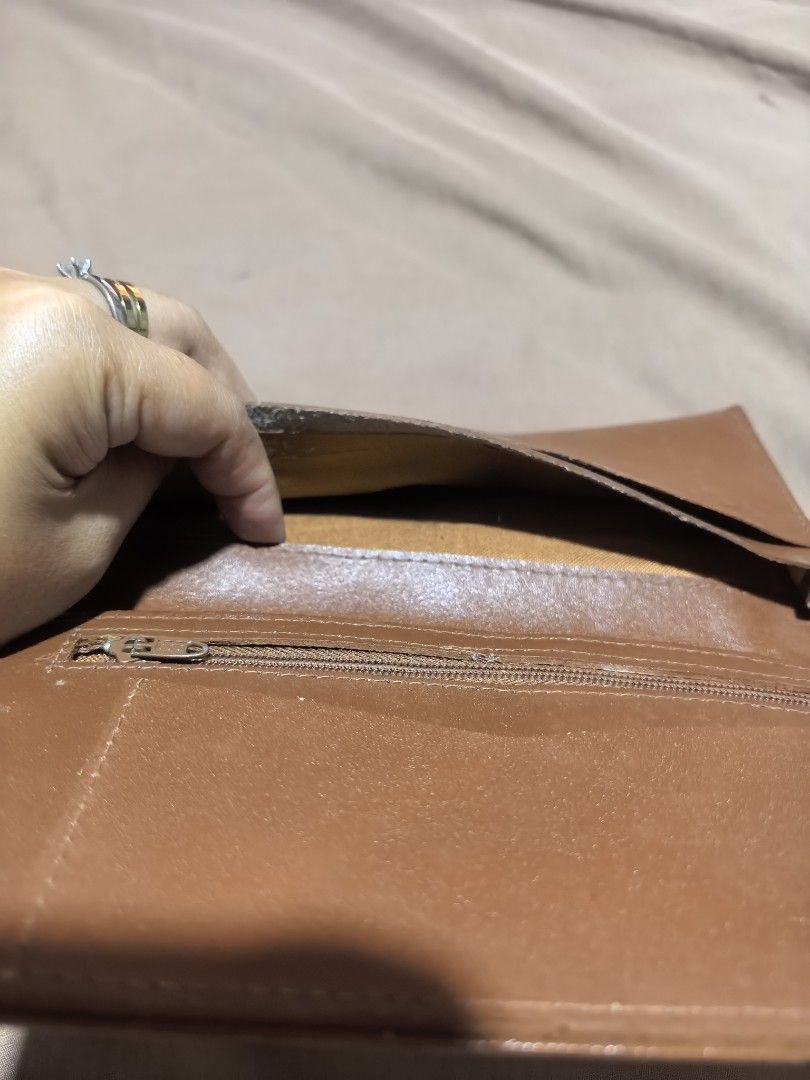 Brown Patchwork Design Long Wallet (Category: Wallets & Card Holders) located in Manila. Submitted by cura.ta88 (Listing ID 1468397277, Image 3). Description: - Stylish brown long wallet with textured patchwork front and dark brown trim - Smooth zip-around closure to keep your items secure - Brown leather interior lined with multiple compartments and card slots - Convenient inner zippered coin pocket - Standard long wallet size, clean inside and 