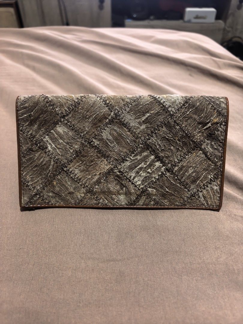 Brown Patchwork Design Long Wallet (Category: Wallets & Card Holders) located in Manila. Submitted by cura.ta88 (Listing ID 1468397277, Image 1). Description: - Stylish brown long wallet with textured patchwork front and dark brown trim - Smooth zip-around closure to keep your items secure - Brown leather interior lined with multiple compartments and card slots - Convenient inner zippered coin pocket - Standard long wallet size, clean inside and 