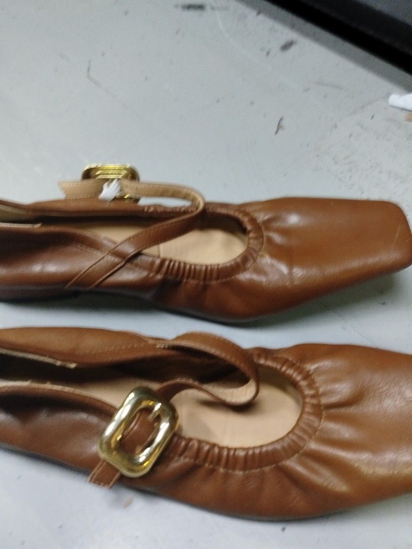 Brown Square Toe Ballet Flats with Buckle (Category: Flats & Sandals) located in Quezon City. Submitted by cuteitemsonlyyy (Listing ID 1468416805, Image 1). Description: - Color: Tan brown - Toe Design: Chic square toe - Fit & Details: Elasticated collar with a crossover ankle strap and gold-tone buckle hardware - Interior: Light tan lining - Condition: Clean uppers and soles showing minimal handling, like new.