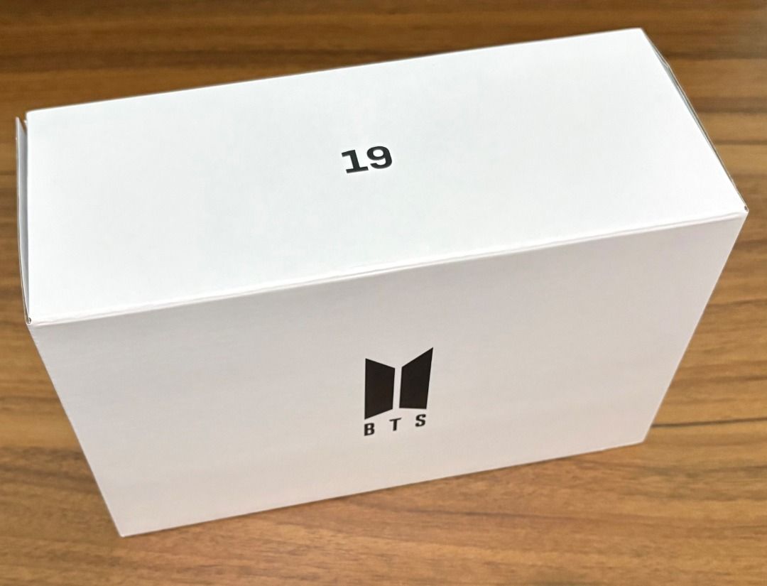 BTS Merch Box 19 (Category: K-Wave Merchandise) located in Baguio. Submitted by shine.dream.smile (Listing ID 1468442349, Image 1). Description: Condition - Unopened (no seal when it arrived but was never opened by the seller) - Damages/imperfections: Original box has arrived with slight imperfections (stains and scratches). Details - Inclusions: Out box, date keeper, special magnet, photo (selfie), photo holder, Weverse bubble wrap and seller’s 