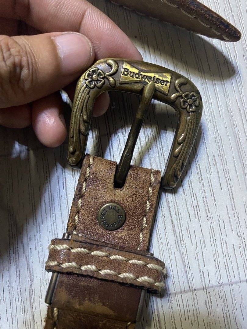 Budweiser Vintage Leather Belt (Category: Belts) located in Pasig City. Submitted by terrencec34805 (Listing ID 1468475456, Image 1). Description: Budweiser vintage Brown leather with brass buckle Floral engraving on the buckle with woven cut-out strap details In good condition Size:Fit to 34-38.