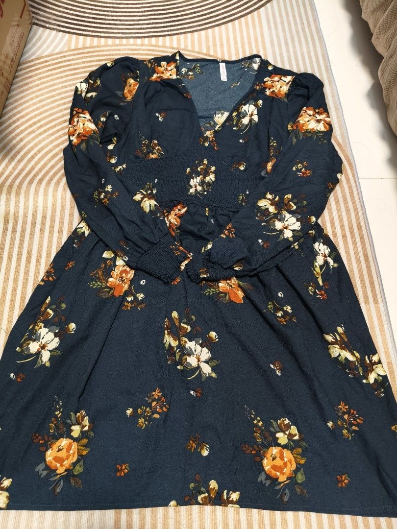Bundle of 3 Floral and Solid Black Dresses (Category: Dresses) located in Valenzuela. Submitted by purpleubangtan (Listing ID 1468336870, Image 1). Description: - Bundle of 3 stylish dresses - Dress 1: Dark blue long-sleeve dress with yellow and white floral print - Dress 2: Black short-sleeve wrap dress with red floral print and ruffled hem - Dress 3: Solid black short-sleeve dress with Swiss dot texture, tie-front neckline, and ruffled hem - Al