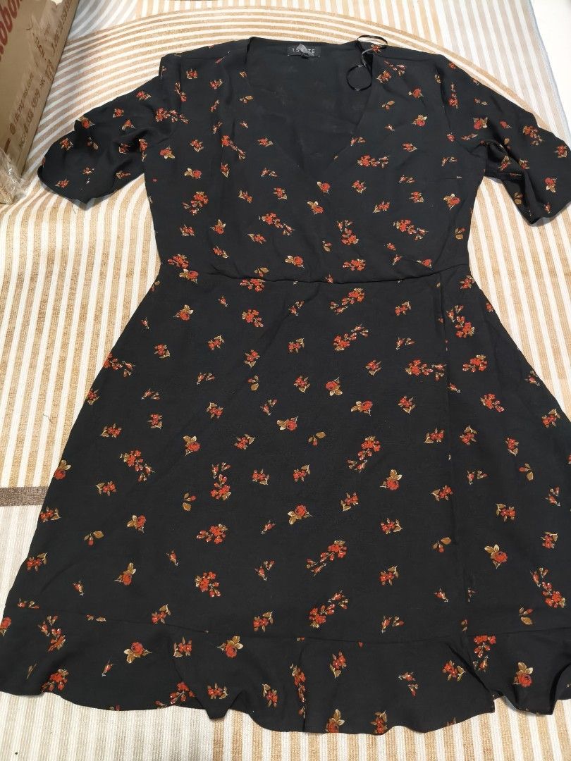 Bundle of 3 Floral and Solid Black Dresses (Category: Dresses) located in Valenzuela. Submitted by purpleubangtan (Listing ID 1468336870, Image 2). Description: - Bundle of 3 stylish dresses - Dress 1: Dark blue long-sleeve dress with yellow and white floral print - Dress 2: Black short-sleeve wrap dress with red floral print and ruffled hem - Dress 3: Solid black short-sleeve dress with Swiss dot texture, tie-front neckline, and ruffled hem - Al