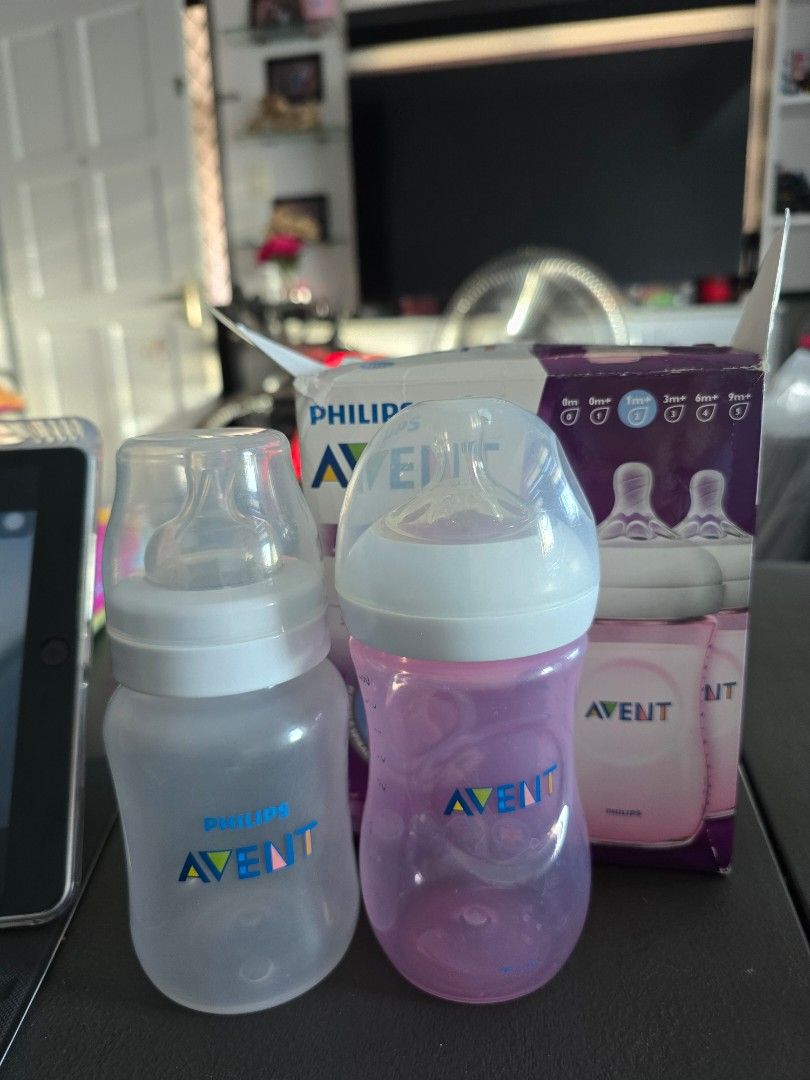 BUNDLE Philips Avent Natural Baby Bottles (Category: Breastfeeding & Bottle Feeding) located in Mandaluyong City. Submitted by _monamourph (Listing ID 1468359312, Image 1). Description: - Brand: Philips Avent Natural - Capacity: 250ml per bottle - Color/Inclusions: 1 pink and 1 clear bottle in original box - Recommended Age: 1m+ with natural latch nipples (#2 and #4 nipples) - Condition: Lightly used ready to use; original box shows minor storage