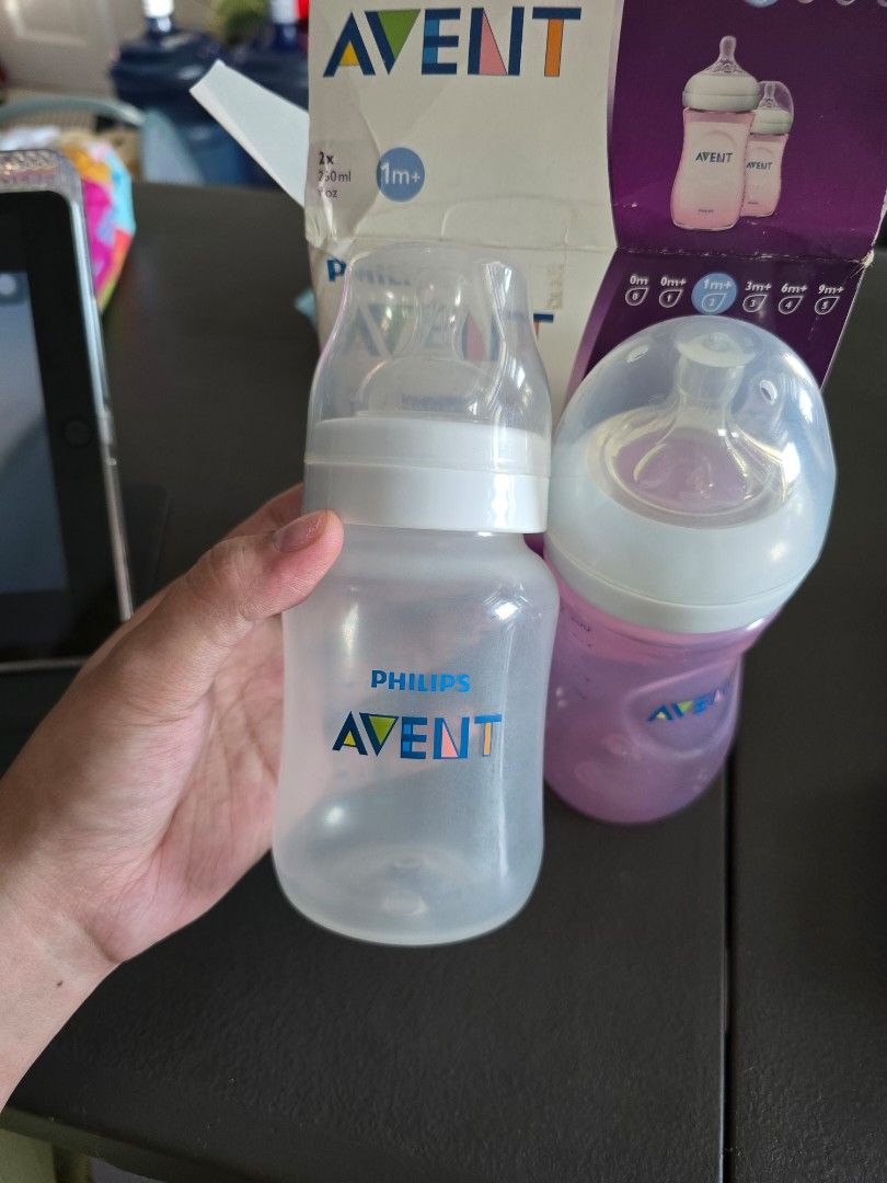 BUNDLE Philips Avent Natural Baby Bottles (Category: Breastfeeding & Bottle Feeding) located in Mandaluyong City. Submitted by _monamourph (Listing ID 1468359312, Image 3). Description: - Brand: Philips Avent Natural - Capacity: 250ml per bottle - Color/Inclusions: 1 pink and 1 clear bottle in original box - Recommended Age: 1m+ with natural latch nipples (#2 and #4 nipples) - Condition: Lightly used ready to use; original box shows minor storage
