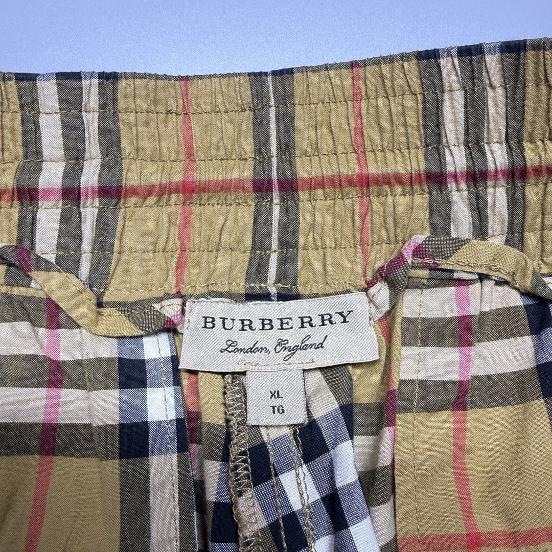 Burberry (Category: Luxury Apparel) located in Kabacan. Submitted by rags2penny.phl (Listing ID 1468331903, Image 3). Description: - Brand: Burberry London England - Style: Vintage check cotton shorts - Colorway: Beige, black, white, and red - Size: XL - Material: 100% cotton (Made in Thailand) - Features: Elastic waistband with adjustable black drawstring, black side stripes, and back pocket - Condition: Brand new / Excellent - Styling: Casual l