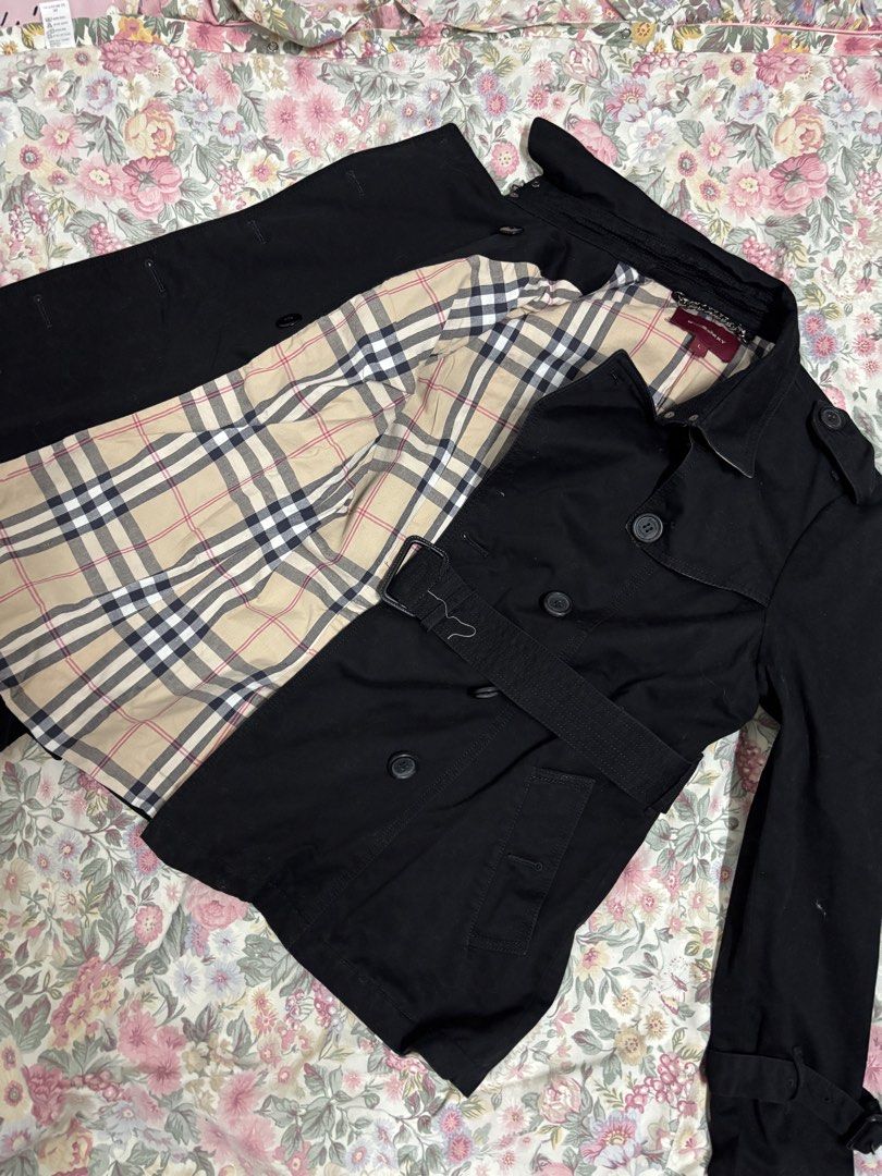 Burberry Black Trench Coat Size L (Category: Coats, Jackets and Outerwear) located in Manila. Submitted by urthrifthany (Listing ID 1468454985, Image 2). Description: - Brand: Burberry - Color: Classic Black with Nova Check lining - Size: Large (L) - Style: Double-breasted button front with matching belt and buckle - Details: Shoulder epaulets, belted cuffs, and chain hanging loop at the collar - Condition: Excellent, timeless piece for cooler we