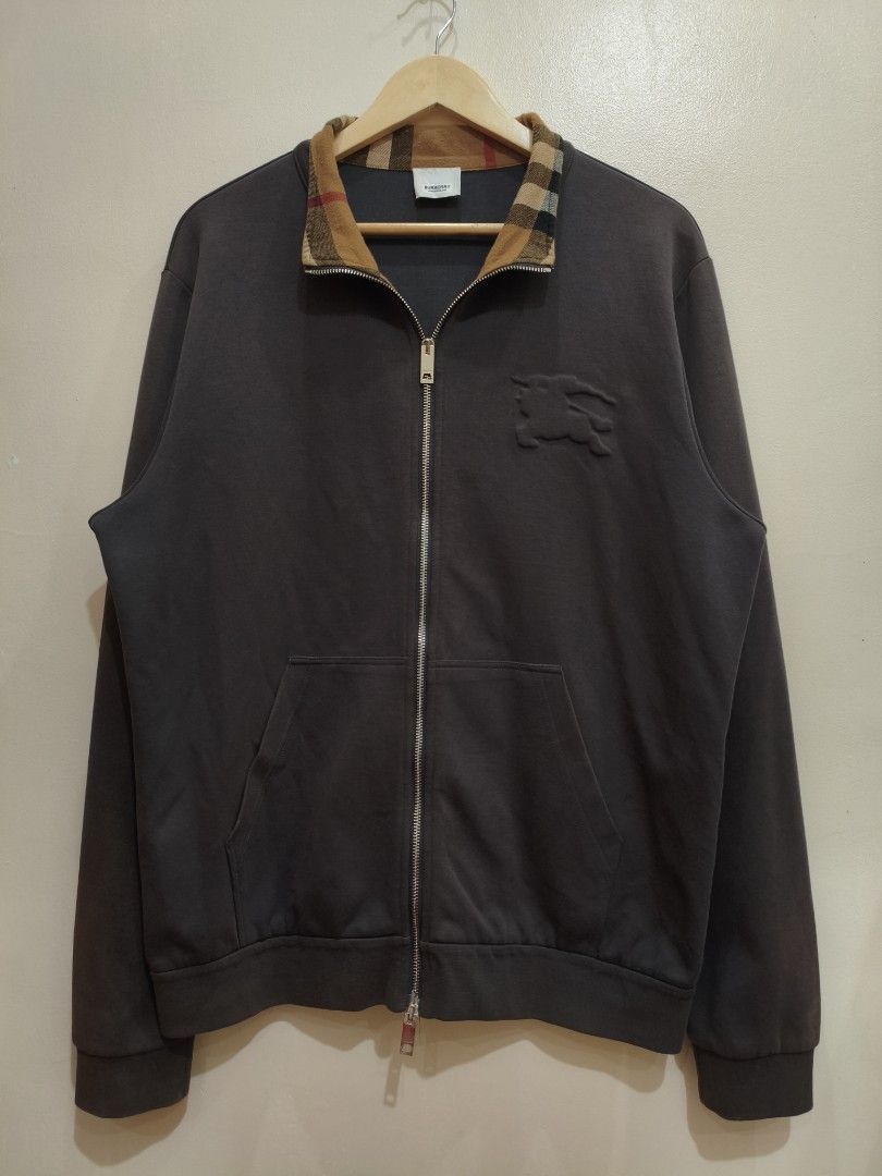 Burberry Brown/Gray Double-Zip Jacket (Category: Coats, Jackets and Outerwear) located in Mandaluyong City. Submitted by frivsthriftsph (Listing ID 1468450341, Image 1). Description: Burberry Brown/Gray Double-Zip Jacket Lightly used condition. Color rate is 8/10. Size 3XL on tag. Actual dimes are 24W by 29L. No other issue aside from sunfade (see 6th and 7th photo for reference)..