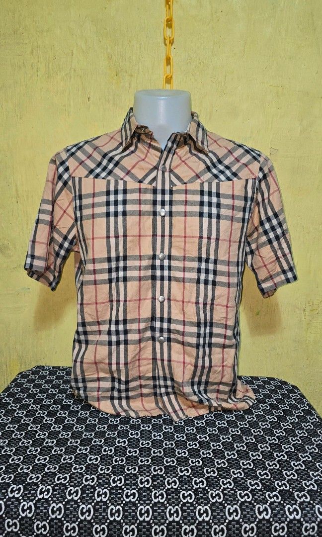 Burberry plaid Polo (Category: Tshirts & Polo Shirts ) located in Hinigaran. Submitted by thrift_street_6106 (Listing ID 1468427744, Image 1). Description: Burberrry polo) Snap Dimes'21'27. Medium Good as new. No issue.
