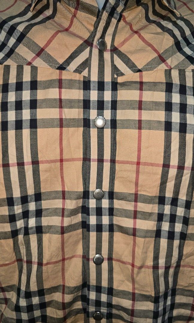 Burberry plaid Polo (Category: Tshirts & Polo Shirts ) located in Hinigaran. Submitted by thrift_street_6106 (Listing ID 1468427744, Image 2). Description: Burberrry polo) Snap Dimes'21'27. Medium Good as new. No issue.
