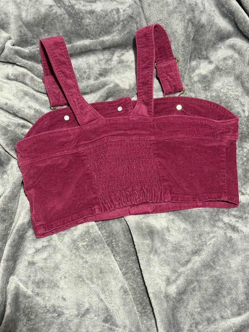 Burgundy corduroy crop top button down cami (Category: Sleeveless) located in Manila. Submitted by nixfinds.co (Listing ID 1468327588, Image 2). Description: - Color: Rich burgundy - Material: Soft corduroy texture - Design: Crop top with adjustable shoulder straps - Closure: Front button-down with 4 round gold-tone metal buttons - Fit: Smocked elastic panel on the back for a comfortable, stretchy fit - Condition: Used but not abused (Ready to sh