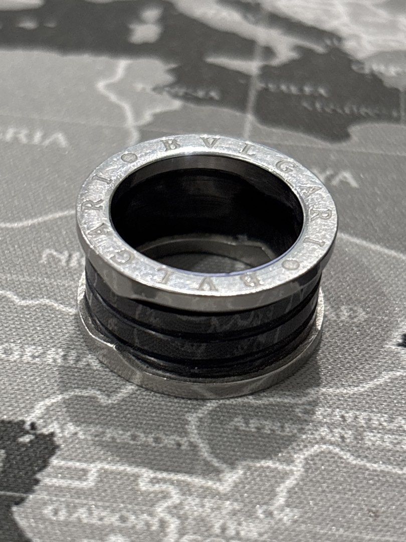 Bvlgari B.zero1 Silver and Black Ring NEGOTIABLE (Category: Rings) located in Malabon City. Submitted by luxgoals (Listing ID 1468322308, Image 1). Description: - Brand: Bvlgari B.zero1 Ring - Design: Bold chunky style with silver-tone metal and striking black spiral bands - Details: Signature BVLGARI lettering engraved along the top and bottom edges - Comfort: Smooth interior finish for easy everyday wear - Style: Classic statement piece that el