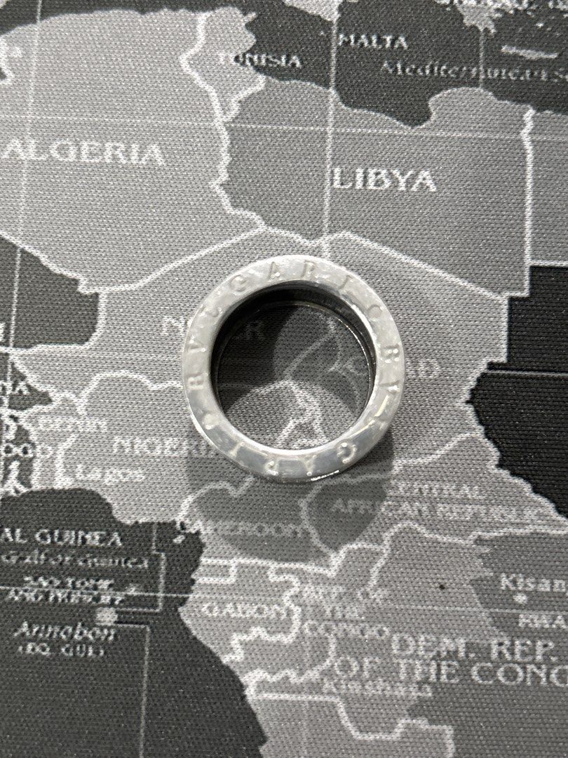 Bvlgari B.zero1 Silver and Black Ring NEGOTIABLE (Category: Rings) located in Malabon City. Submitted by luxgoals (Listing ID 1468322308, Image 3). Description: - Brand: Bvlgari B.zero1 Ring - Design: Bold chunky style with silver-tone metal and striking black spiral bands - Details: Signature BVLGARI lettering engraved along the top and bottom edges - Comfort: Smooth interior finish for easy everyday wear - Style: Classic statement piece that el