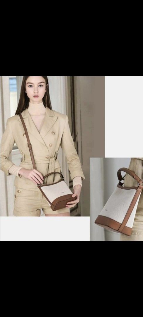by ESQUIRE Canvas Bucket Bag (Category: Shoulder Bags) located in Manila. Submitted by daisyduck09 (Listing ID 1468362905, Image 1). Description: - Brand: ESQUIRE bucket bag - Color/Material: Cream canvas with brown faux leather trim - Condition: Brand new, never used, with clean interior and exterior (clear protective wrapping still on handle and strap) - Versatility: Includes a short top handle and a detachable, adjustable shoulder strap - Incl