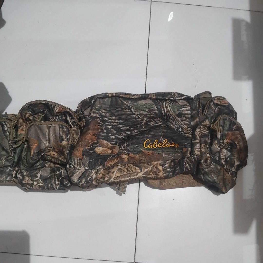 Cabela's Seclusion 3D Camouflage Waist Pack (Category: Belt bags, Clutches and Pouches) located in Manila. Submitted by alexson10 (Listing ID 1468420193, Image 1). Description: - Authentic Cabela's waist pack in Seclusion 3D camouflage pattern - Multiple zippered compartments and front pockets for organized gear storage - Adjustable brown webbed strap with durable branded plastic buckle - Comfortable tan fabric backing on the main compartment - I