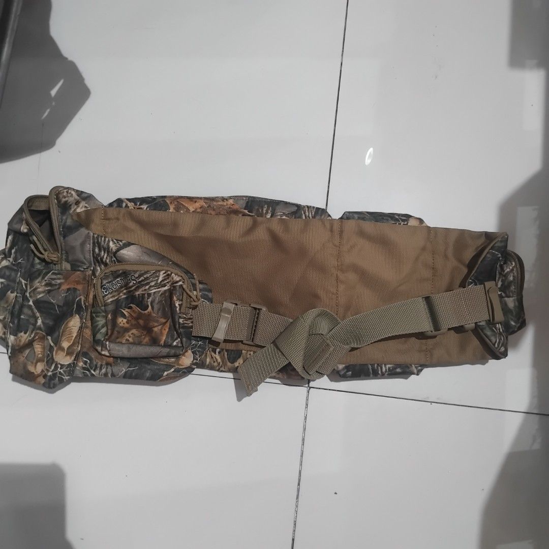 Cabela's Seclusion 3D Camouflage Waist Pack (Category: Belt bags, Clutches and Pouches) located in Manila. Submitted by alexson10 (Listing ID 1468420193, Image 2). Description: - Authentic Cabela's waist pack in Seclusion 3D camouflage pattern - Multiple zippered compartments and front pockets for organized gear storage - Adjustable brown webbed strap with durable branded plastic buckle - Comfortable tan fabric backing on the main compartment - I