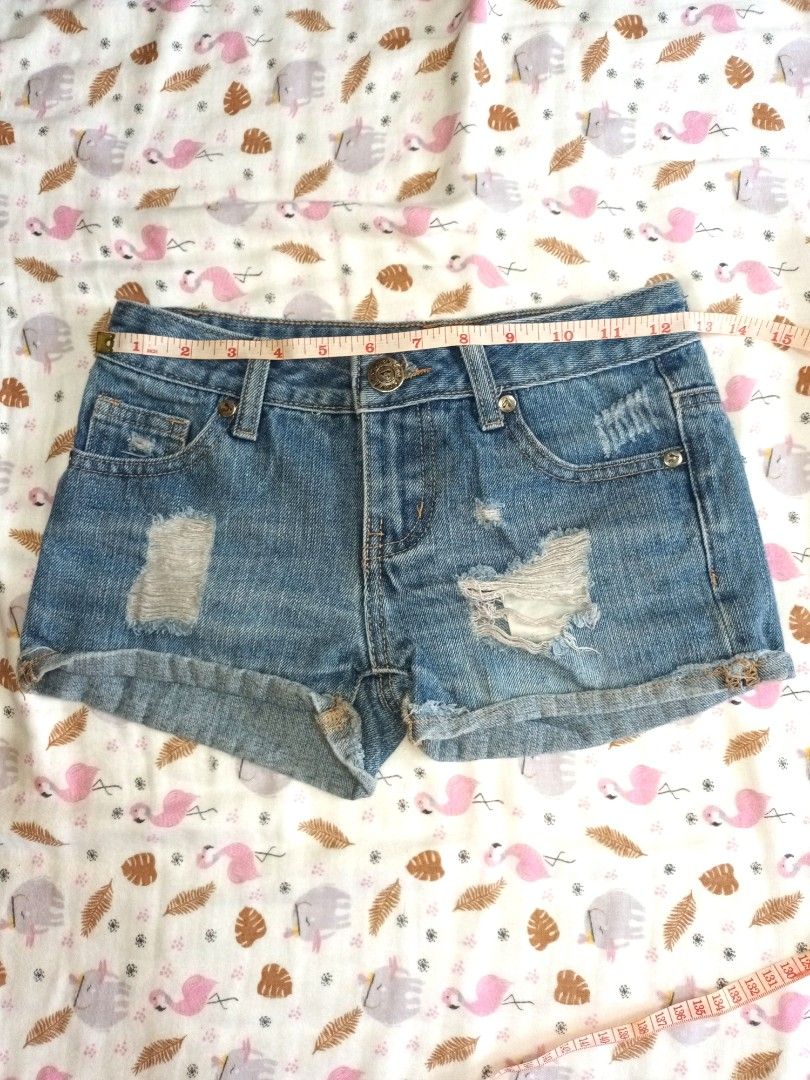 Calvin Klein Jeans Denim Shorts (Category: Shorts) located in Pasig City. Submitted by zeallion_149f0e (Listing ID 1468336198, Image 3). Description: - Brand: Calvin Klein Jeans - Color: Dark blue denim - Style: Rolled-up cuffs, classic five-pocket design, front pocket branded patch - Details: Contrast stitching, silver-tone hardware, button closure - Size: Measures roughly 11 inches across the waist laid flat - Condition: Great wardrobe staple f