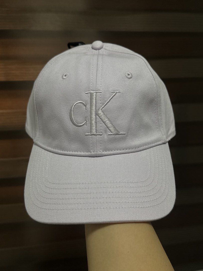 Calvin Klein Monogram Logo Cap-Lilac (Category: Activewear) located in Mandaluyong City. Submitted by shoppingmilesph (Listing ID 1468412668, Image 1). Description: 💜 Original & brand new Calvin Klein 💜Color: Light Lilac 💜 With original CK tags attached 💜 Large embroidered CK logo on the front panel and interior branded taping along the seams .