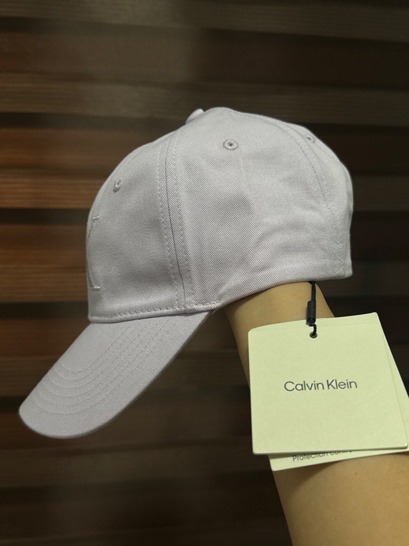 Calvin Klein Monogram Logo Cap-Lilac (Category: Activewear) located in Mandaluyong City. Submitted by shoppingmilesph (Listing ID 1468412668, Image 2). Description: 💜 Original & brand new Calvin Klein 💜Color: Light Lilac 💜 With original CK tags attached 💜 Large embroidered CK logo on the front panel and interior branded taping along the seams .